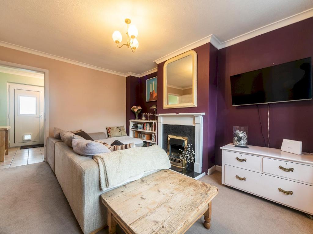 a living room with a couch and a tv at Pass the Keys Comfortable 2bedroom home with free parking in Twickenham