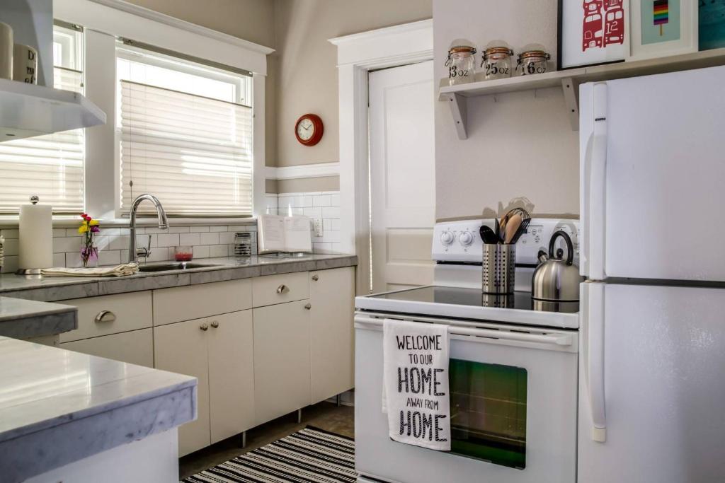 a kitchen with a white refrigerator and a stove at Cooper Spur in Portland