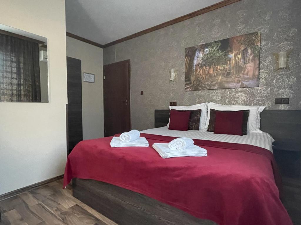 A bed or beds in a room at Asya Guest House