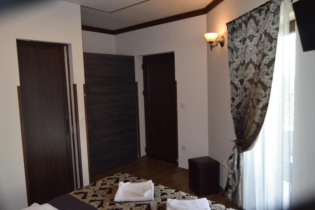 A bed or beds in a room at Asya Guest House