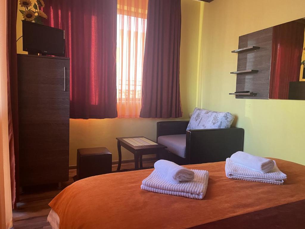 A bed or beds in a room at Asya Guest House