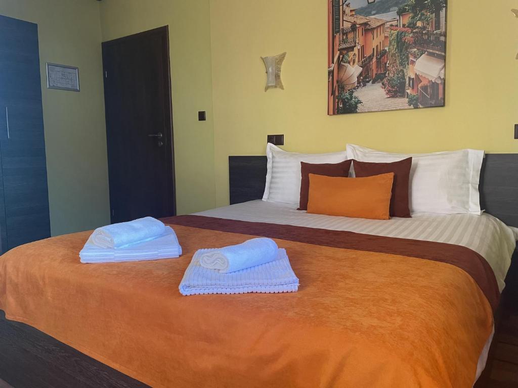 A bed or beds in a room at Asya Guest House