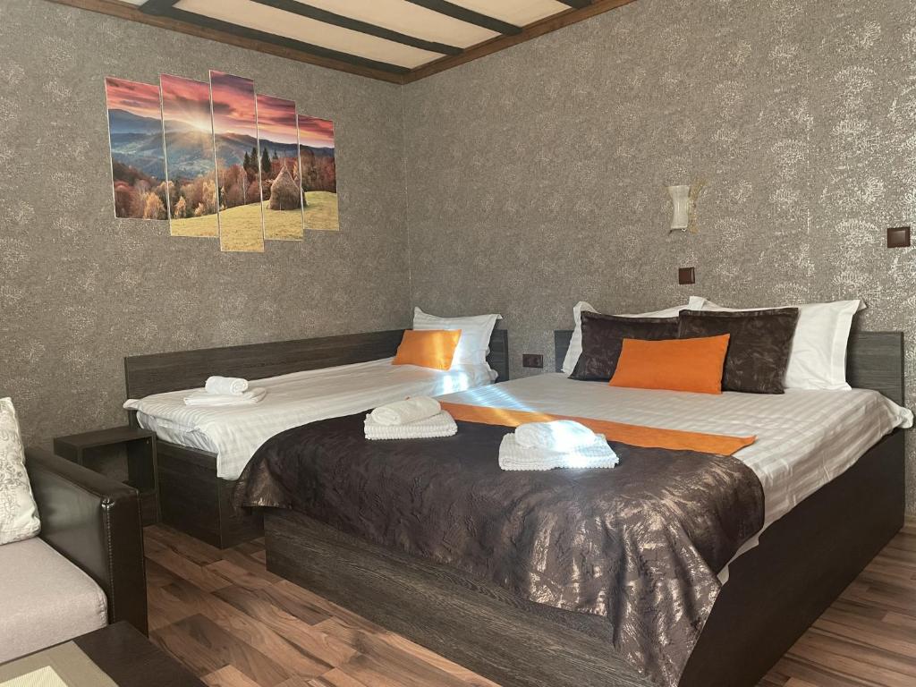 A bed or beds in a room at Asya Guest House