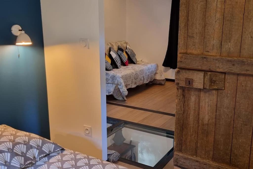 Posteľ alebo postele v izbe v ubytovaní Gîte de caractère à la campagne