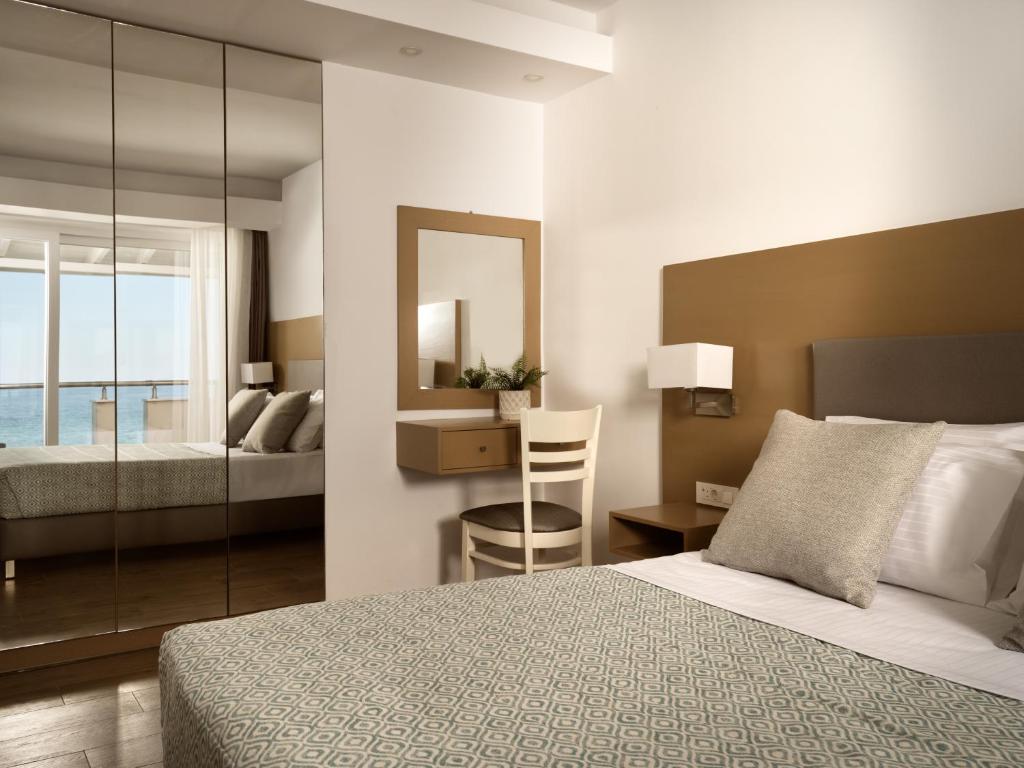 Postel nebo postele na pokoji v ubytování Stefania Apartments