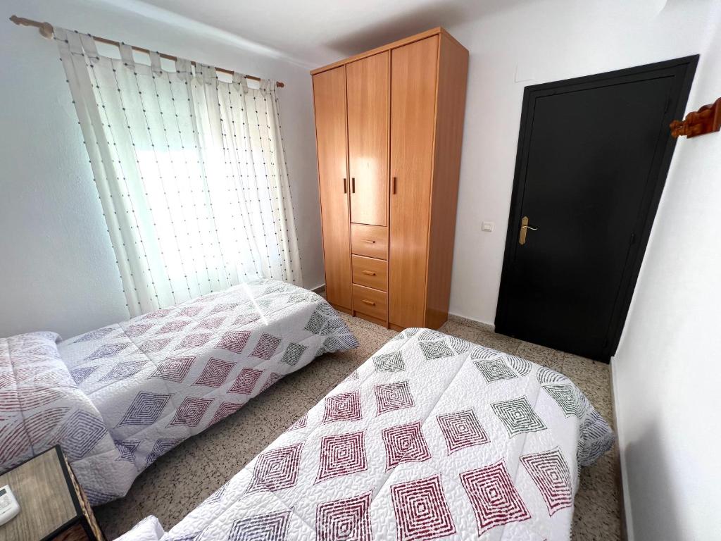 Posteľ alebo postele v izbe v ubytovaní Casa Playa Torrecilla
