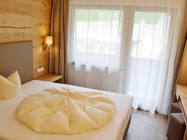 Postel nebo postele na pokoji v ubytování Hotel Neue Post