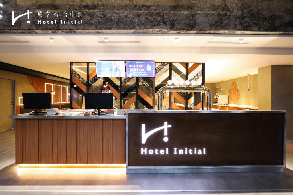 a hotel lobby with aoked limited sign on a counter at Hotel Initial-Taichung in Taichung