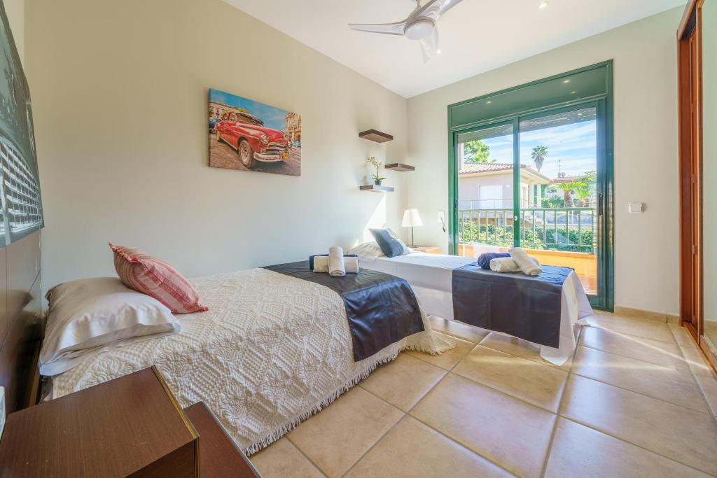 Postel nebo postele na pokoji v ubytování VIlla Jaruco Lux, exclusiva zona residencial con Piscina & Aircon