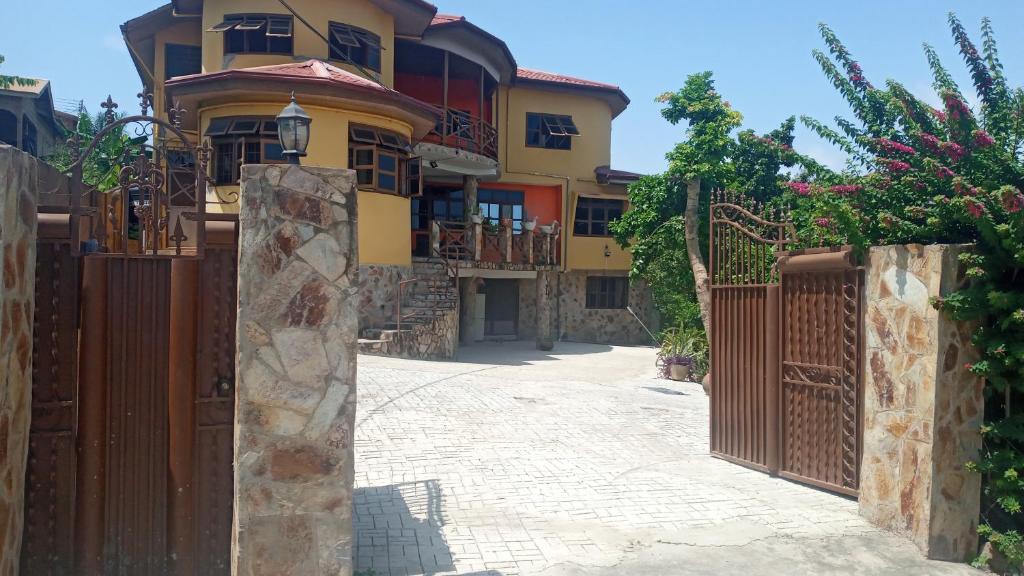 a house with a gate in front of it at Ocean Gaze in Accra