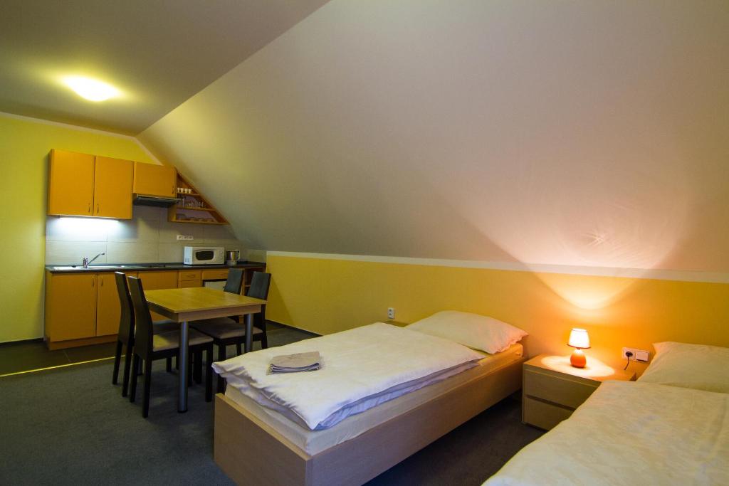 Postel nebo postele na pokoji v ubytování Apartmány Sport with Garage