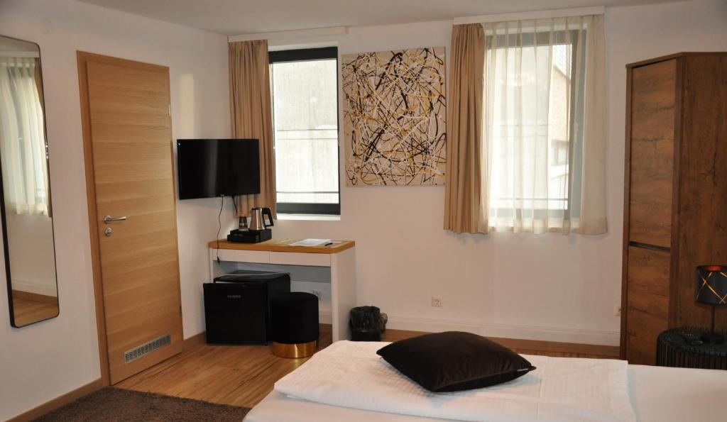 Postel nebo postele na pokoji v ubytování A&C Hotel