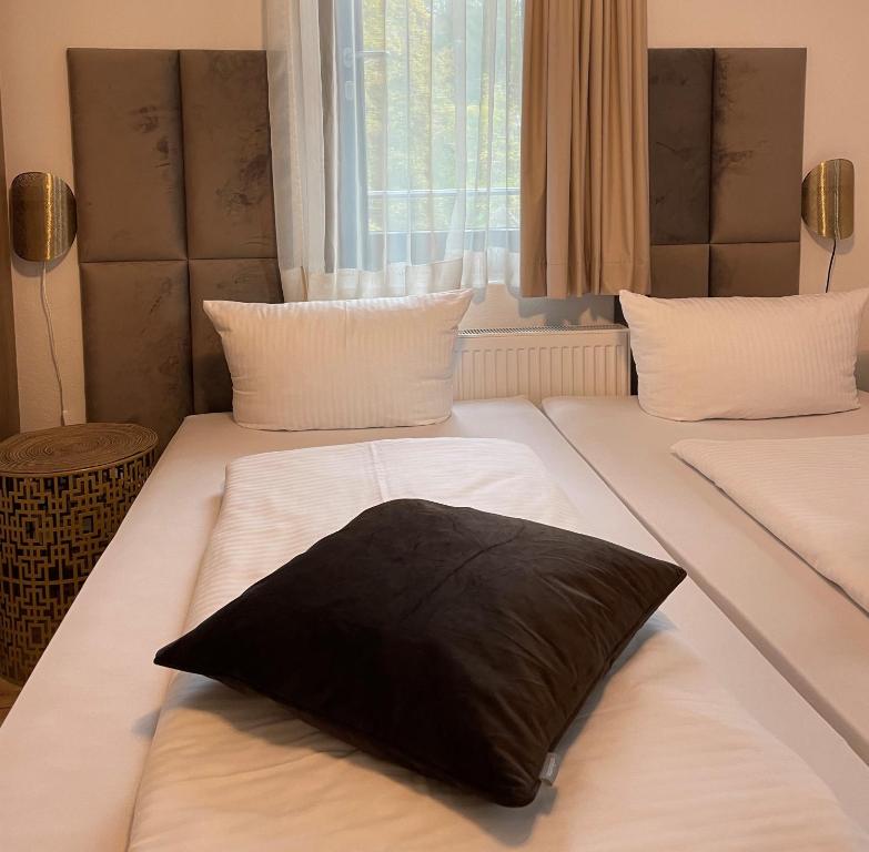 Postel nebo postele na pokoji v ubytování A&C Hotel