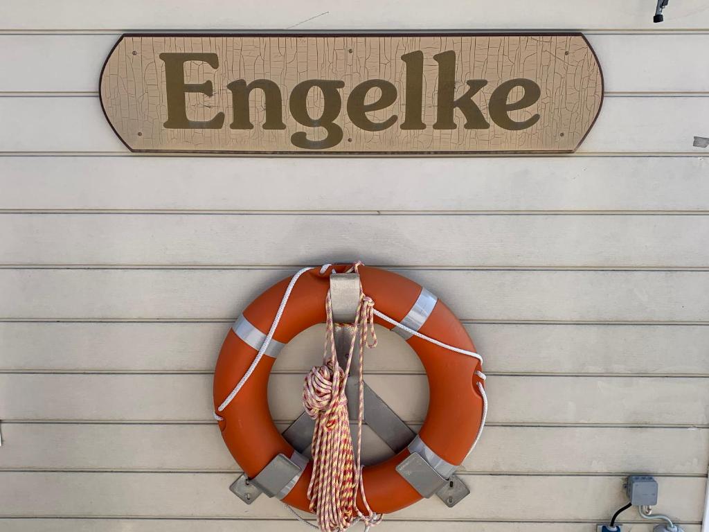 an orange life preserver hanging on a garage at Ferienwohnung Engelke in Emden