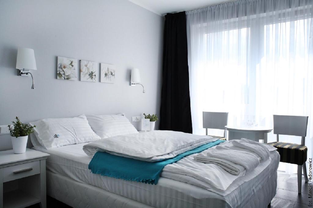 Postel nebo postele na pokoji v ubytování HOTEL Amber Suite & SPA - Enklawa dla Dorosłych