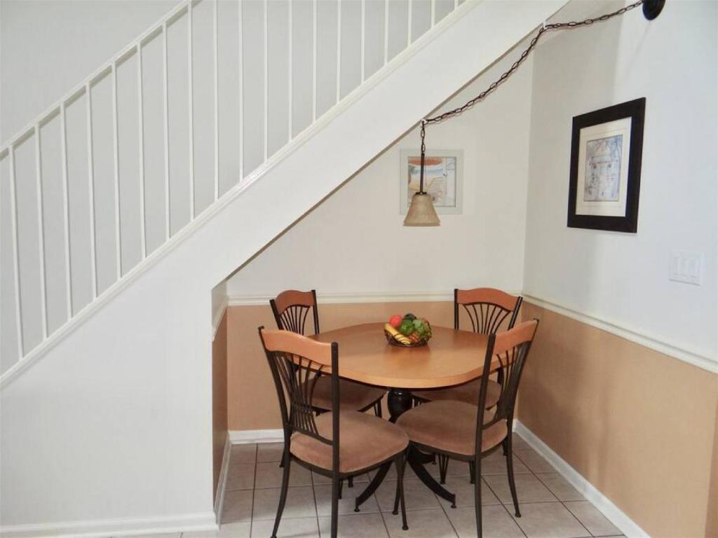a dining room with a table and chairs at Deerfield Plantation 217A2 in Myrtle Beach