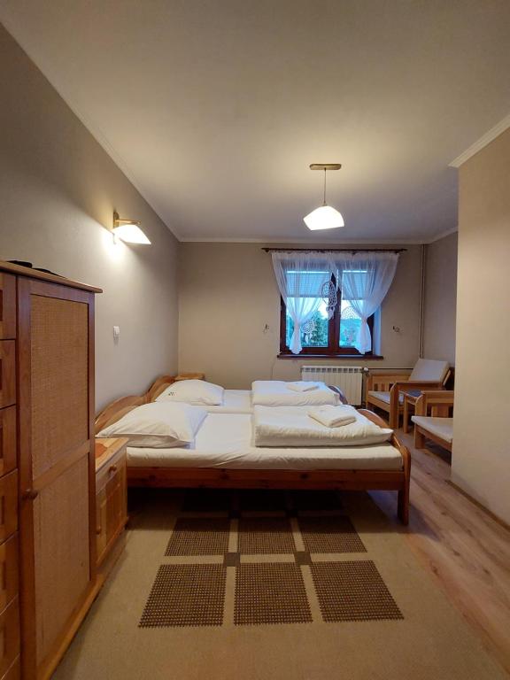Posteľ alebo postele v izbe v ubytovaní Willa Przekop