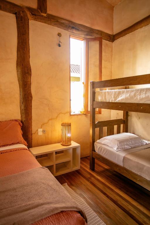 Cama ou camas em um quarto em Casa da Arquiteta Guest House