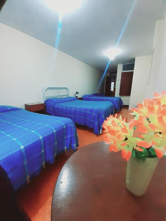 Postel nebo postele na pokoji v ubytování Hotel Central
