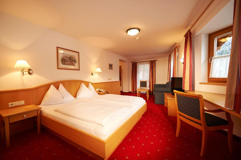 Postel nebo postele na pokoji v ubytování Hotel Wagrainerhof