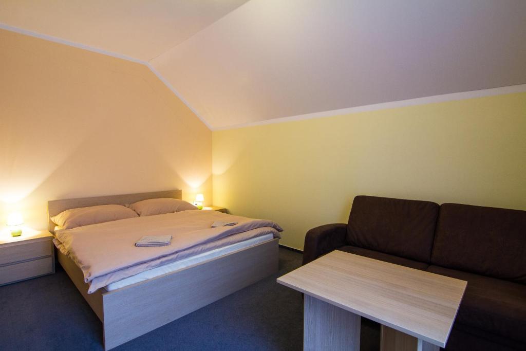 Postel nebo postele na pokoji v ubytování Apartmány Sport with Garage