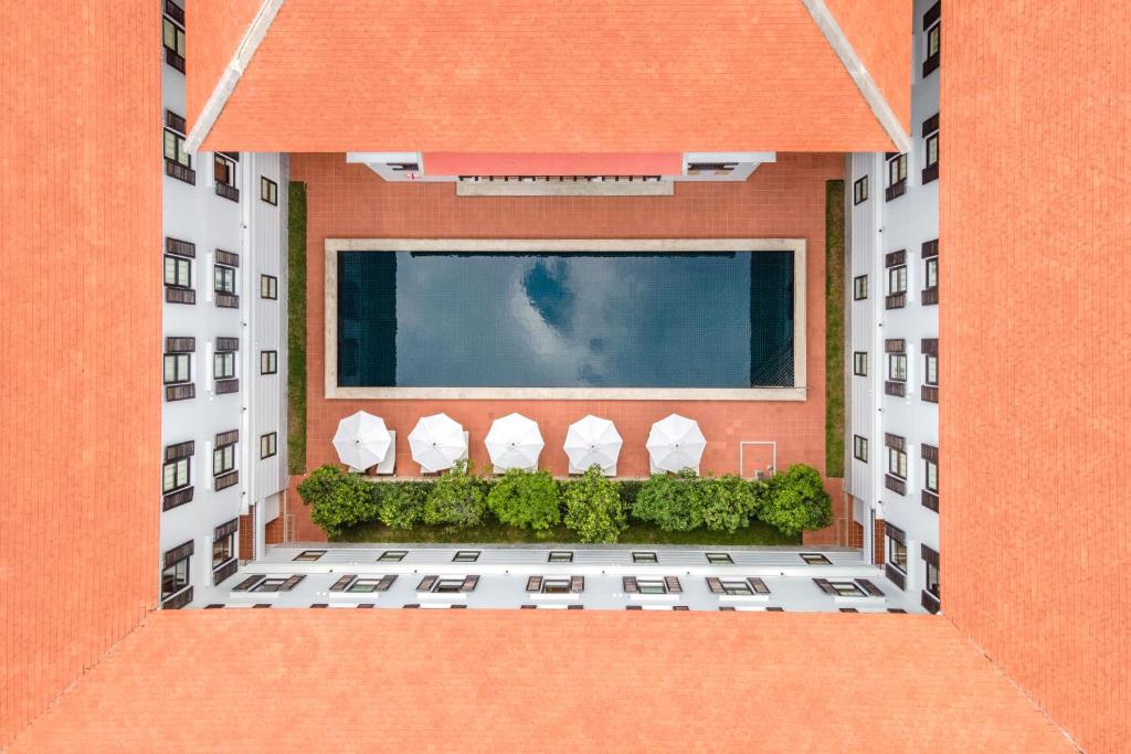 an aerial view of a building with a balcony at Bella Nara Hotel Chiang Mai in Chiang Mai