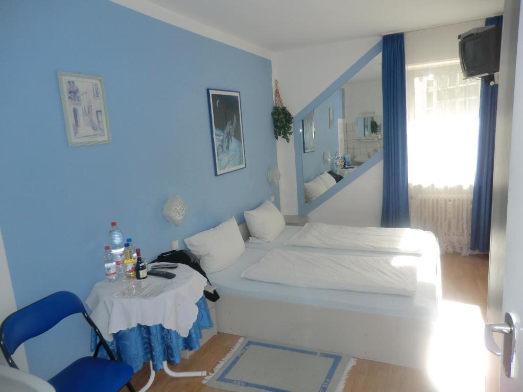 Postel nebo postele na pokoji v ubytování Hotel Pension Haydn
