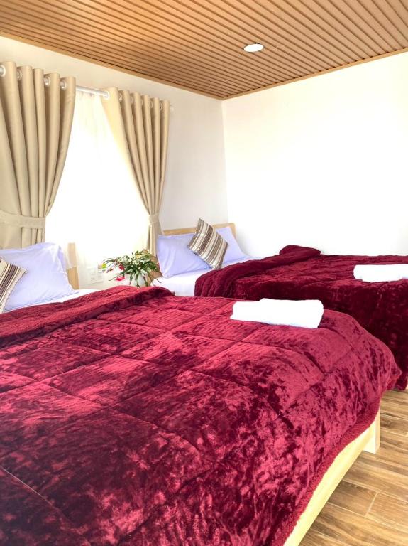Postel nebo postele na pokoji v ubytování Ngọc Nguyên Homestay