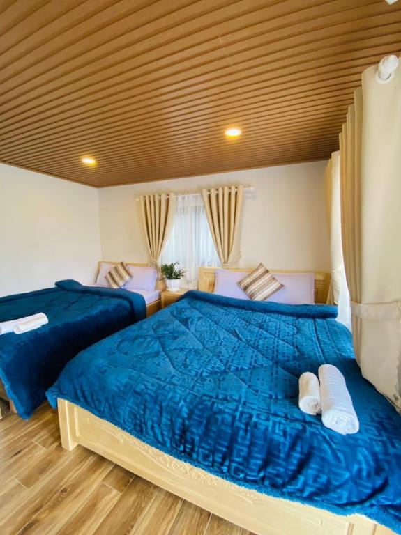 Giường trong phòng chung tại Ngọc Nguyên Homestay