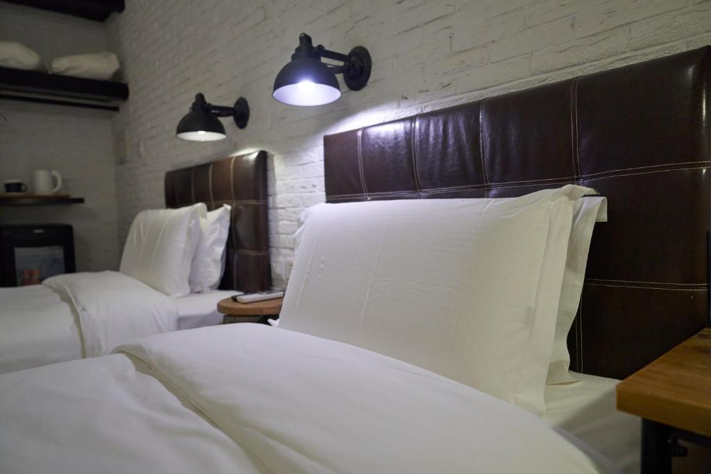 Postel nebo postele na pokoji v ubytování Yi Stack Hotel Beijing