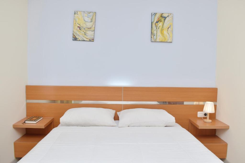 Postel nebo postele na pokoji v ubytování Homestay 82 Syariah Palembang