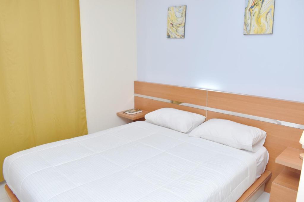 Postel nebo postele na pokoji v ubytování Homestay 82 Syariah Palembang
