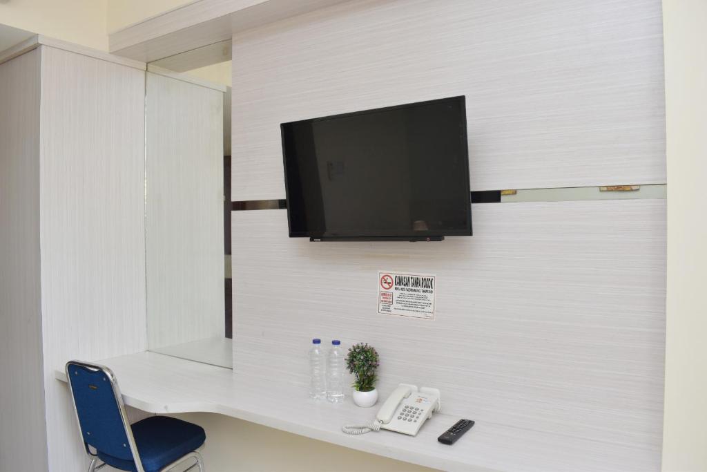 TV a/nebo společenská místnost v ubytování Homestay 82 Syariah Palembang