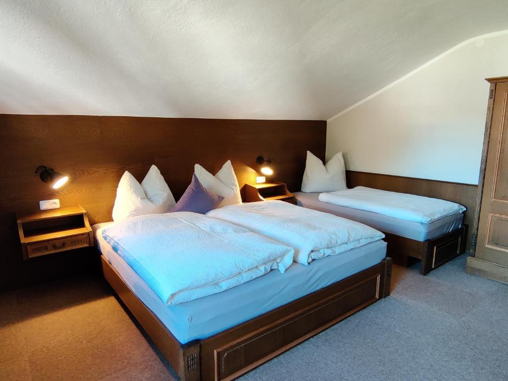 Posteľ alebo postele v izbe v ubytovaní Alpinum Hostel
