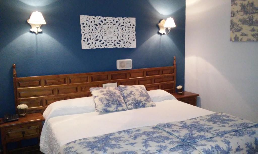 Postel nebo postele na pokoji v ubytování Hotel Boutique Balaitus