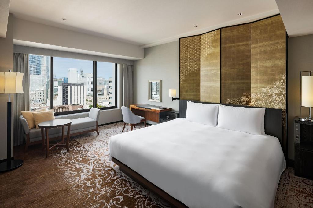 Postel nebo postele na pokoji v ubytování Hyatt Regency Yokohama