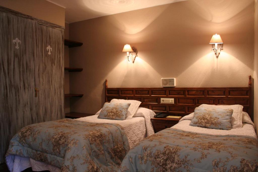 Postel nebo postele na pokoji v ubytování Hotel Boutique Balaitus