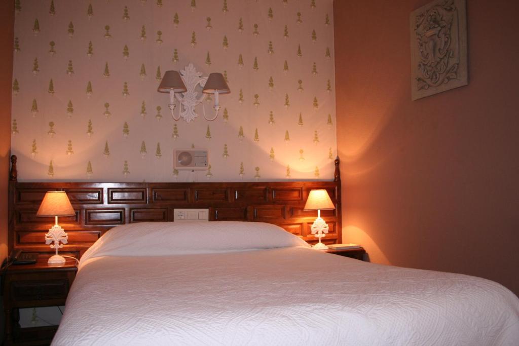 Postel nebo postele na pokoji v ubytování Hotel Boutique Balaitus