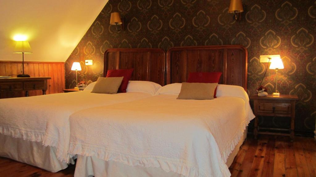 Postel nebo postele na pokoji v ubytování Hotel Boutique Balaitus