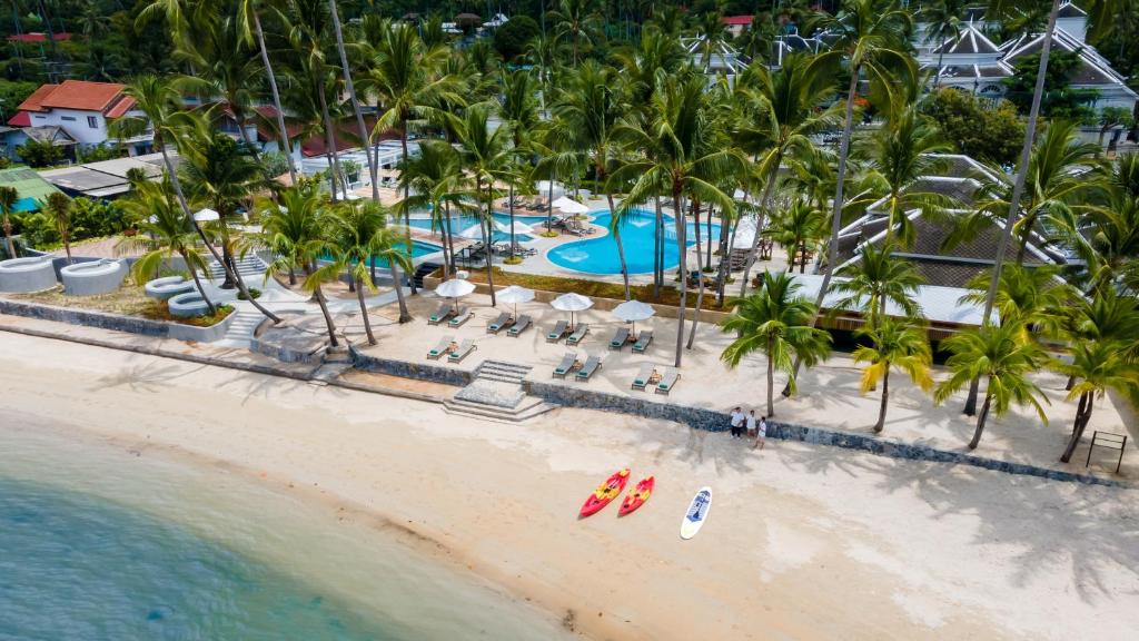 an aerial view of a resort on the beach at Outrigger Koh Samui Beach Resort - SHA Extra Plus in Lamai