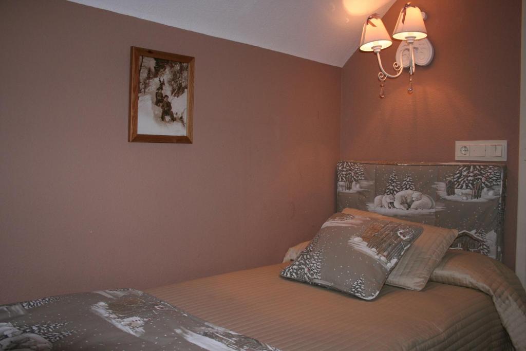 Postel nebo postele na pokoji v ubytování Hotel Boutique Balaitus