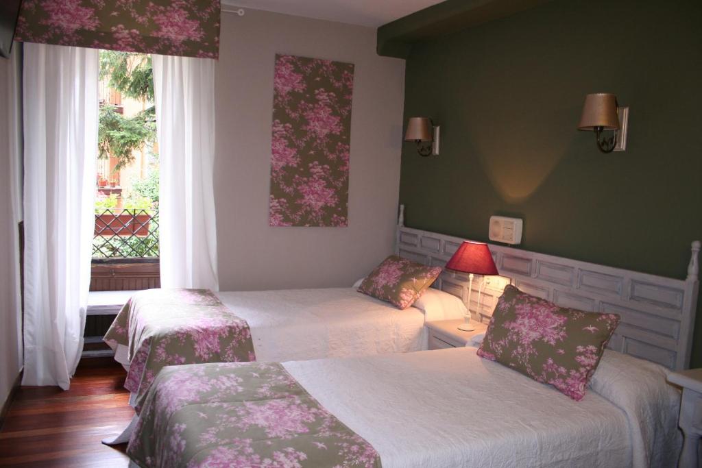 Postel nebo postele na pokoji v ubytování Hotel Boutique Balaitus