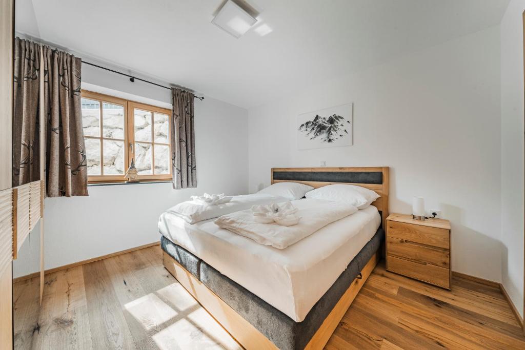 Postel nebo postele na pokoji v ubytování Dachstein West Apartment 1B