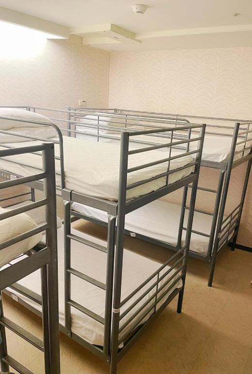 Postel nebo postele na pokoji v ubytování Single inn- KAOHSIUNG LINSEN
