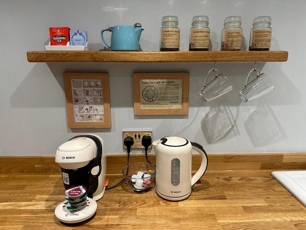 two coffeemakers sitting on top of a kitchen counter at The Beetroot in Margate