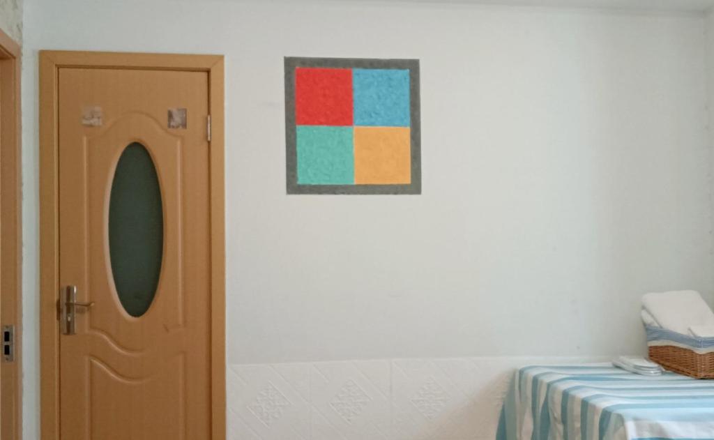 Postel nebo postele na pokoji v ubytování Hangzhou Citynest Music B&B