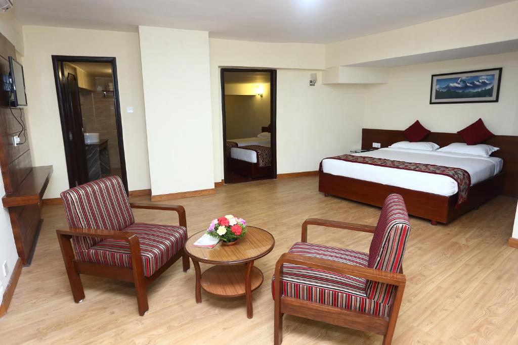 Postel nebo postele na pokoji v ubytování Hotel Woodland Kathmandu