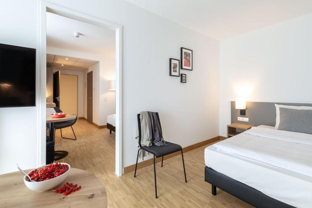 Ein Bett oder Betten in einem Zimmer der Unterkunft Brera Serviced Apartments Stuttgart