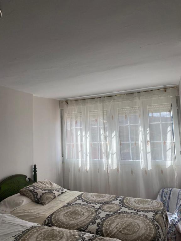 Postel nebo postele na pokoji v ubytování Rebeca Rooms