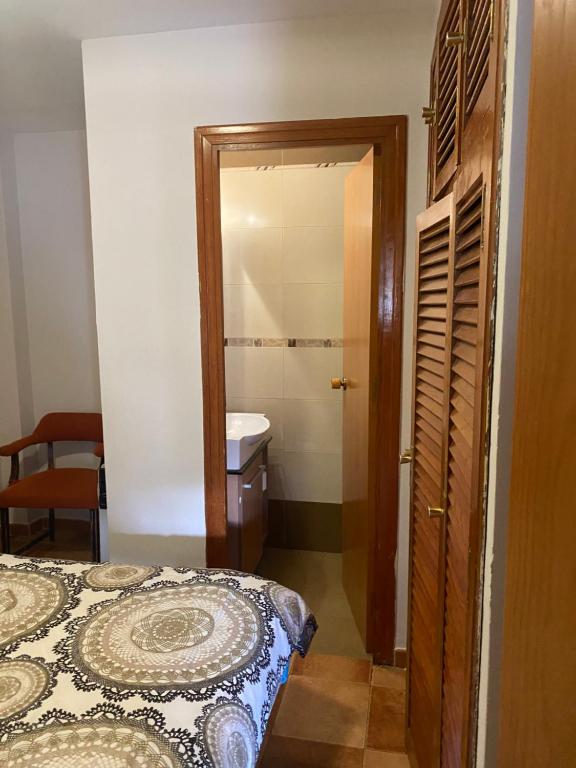 Postel nebo postele na pokoji v ubytování Rebeca Rooms